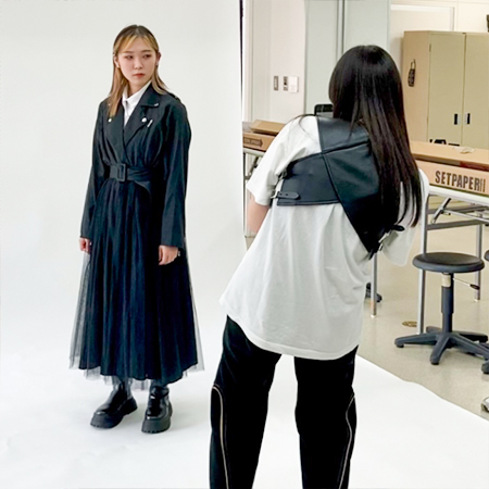 織田ファッション専門学校のファッションビジネス科の授業で写真撮影のお手本を見せている講師
